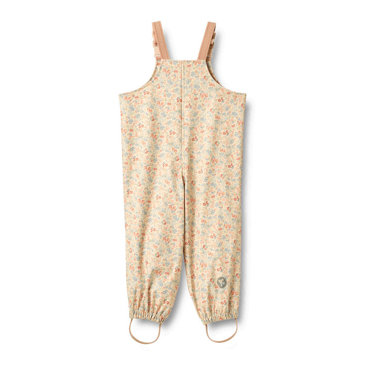 Wheat children's waterproof rain overalls in floral design with adjustable suspenders and elastic leg hems.