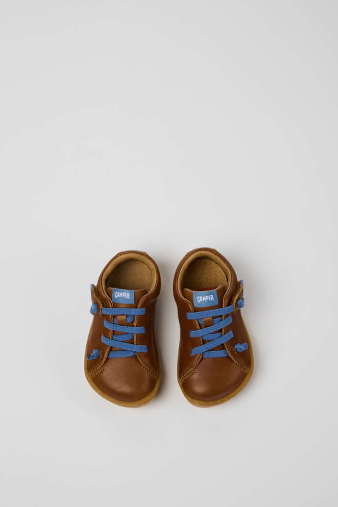 Brown leather kids shoes with blue laces, perfect first walkers from Acorn & Pip.