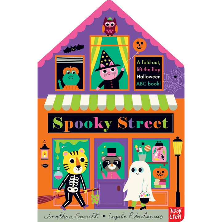 Front cover of the children's book 'Spooky Street' by Jonathan Emmett and Angela Porrhenus, published by Nosy Crow. The illustration shows a colorful house-shaped storefront decorated with Halloween characters and props, including a witch, ghost, skeleton cat, raccoon, owl, pumpkins, and a streetlamp.
