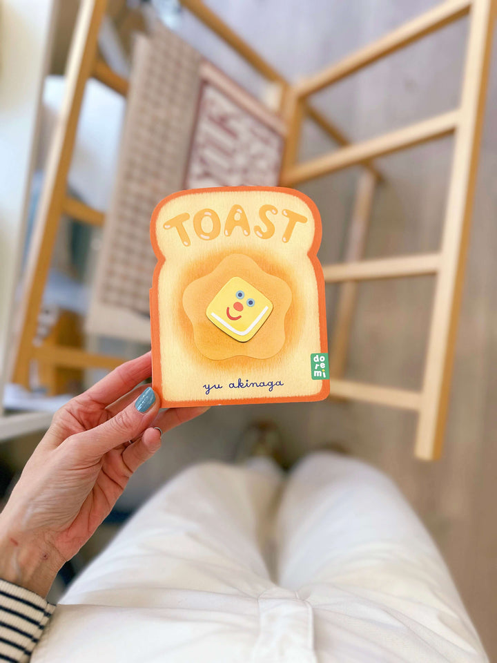Toast board book about food for toddlers, featuring colorful illustrations and a playful design for young readers.
