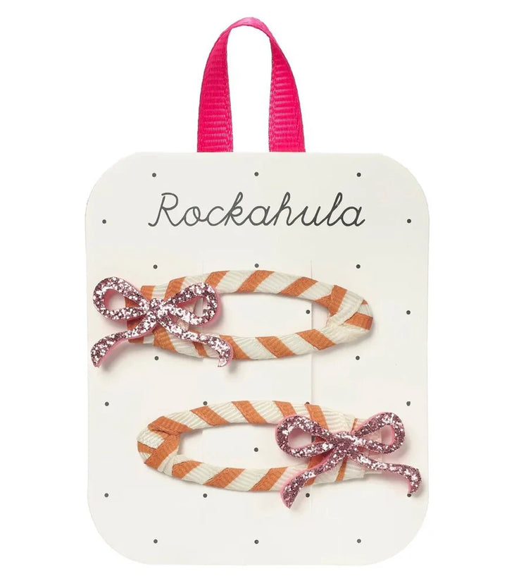 Rockahula glitter bow hair clips on a display card, perfect for gifting to little ones for any special occasion.