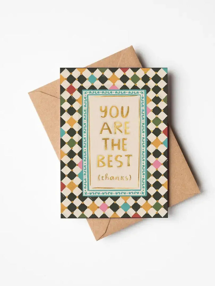 Thank you greetings card with gold foil message on harlequin background, blank inside for personal messages.
