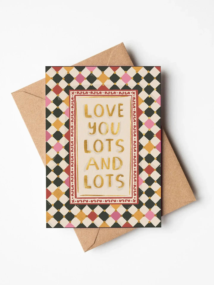 Jenna Crush Valentines day greeting card featuring 'Love you lots and lots' in gold foil with harlequin check background.